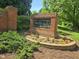 Neighborhood sign with brick surround and landscaped flowerbeds at 2565 Bent Green St, Raleigh, NC 27614