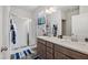 Bathroom featuring a shower, double sinks, and modern fixtures at 270 Oak Park Blvd, Youngsville, NC 27596