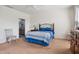 Bedroom featuring a full-sized bed, carpeted floors, and a nearby bathroom at 270 Oak Park Blvd, Youngsville, NC 27596