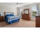 Bright bedroom with two windows, a ceiling fan, and carpeted floors at 270 Oak Park Blvd, Youngsville, NC 27596