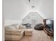 Bright bonus room featuring vaulted ceilings, carpeted floors, table, and a comfortable seating area at 270 Oak Park Blvd, Youngsville, NC 27596
