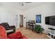 Well decorated bonus room including a flat screen tv and a wet bar at 270 Oak Park Blvd, Youngsville, NC 27596