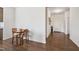 Inviting dining area adjacent to the entryway features wood-look floors and a view of the front door at 270 Oak Park Blvd, Youngsville, NC 27596