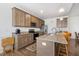 Well-equipped kitchen with granite counters, stainless steel appliances, and a functional island offering seating at 270 Oak Park Blvd, Youngsville, NC 27596