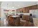 Spacious kitchen featuring granite countertops, stainless steel appliances, a kitchen island, and ample cabinet space at 270 Oak Park Blvd, Youngsville, NC 27596