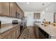 Spacious kitchen with granite counters, stainless appliances, island with bar seating, and a stylish decorative rug at 270 Oak Park Blvd, Youngsville, NC 27596
