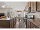 Open-concept kitchen with granite countertops, ample cabinetry, and a seamless flow into the adjacent dining area at 270 Oak Park Blvd, Youngsville, NC 27596