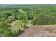 An aerial view of this homes location surrounded by lush and vibrant forests at 2705 Flat Rock Rd, Franklinton, NC 27525