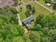 Aerial view of home featuring a private fenced yard, in-ground pool, and a wooded setting at 2705 Flat Rock Rd, Franklinton, NC 27525