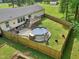 Aerial backyard view of home featuring an above-ground pool, deck, patio, and fenced yard at 2705 Flat Rock Rd, Franklinton, NC 27525