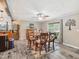 Open dining room features a wooden table and chairs, neutral walls, and natural light at 2705 Flat Rock Rd, Franklinton, NC 27525