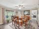 Cozy dining area boasts a wood table with seating for six, neutral walls, and a view of the back deck at 2705 Flat Rock Rd, Franklinton, NC 27525