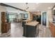 Open concept kitchen shows stainless appliances, light wood cabinets and flows into the dining area at 2705 Flat Rock Rd, Franklinton, NC 27525