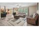 Spacious living room with plush sofas, neutral walls, modern flooring, and lots of natural light at 2705 Flat Rock Rd, Franklinton, NC 27525