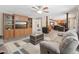 Open-concept living room features built-in shelving and entertainment unit, with views into the kitchen at 2705 Flat Rock Rd, Franklinton, NC 27525