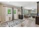 Spacious living room with a door to the outside and plush seating, perfect for relaxing and entertaining at 2705 Flat Rock Rd, Franklinton, NC 27525