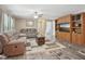 Bright living room boasts plush sofas, neutral color palette, modern flooring, and lots of natural light at 2705 Flat Rock Rd, Franklinton, NC 27525