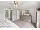 Serene main bedroom with a neutral color scheme, featuring carpeted floors, an elegant dresser, and an en-suite bathroom access at 2705 Flat Rock Rd, Franklinton, NC 27525