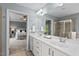 Bright bathroom featuring a dual-sink vanity, a soaking tub, and a separate shower at 2728 Evanston Ave, Durham, NC 27703