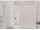 Clean bathroom featuring a white tub-shower combo with a shower head at 2728 Evanston Ave, Durham, NC 27703