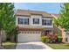 Charming two-story home featuring a brick-accented garage and well-maintained landscaping at 2728 Evanston Ave, Durham, NC 27703