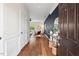 Warm and inviting entryway with hardwood floors leading to the living area at 2728 Evanston Ave, Durham, NC 27703