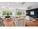 Spacious eat-in kitchen with stainless appliances, granite counters, and an open-concept design at 2728 Evanston Ave, Durham, NC 27703