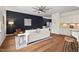 Cozy living area with hardwood floors, neutral tones, and large window views at 2728 Evanston Ave, Durham, NC 27703