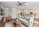Spacious living room featuring an open floor plan with a kitchen and hardwood floors at 2728 Evanston Ave, Durham, NC 27703