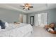 Inviting main bedroom with neutral tones, tray ceiling, and convenient ensuite access at 2728 Evanston Ave, Durham, NC 27703