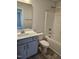 Well-lit bathroom with white countertops, gray cabinets, and a bathtub-shower combo at 29 High Hampton Way, Fuquay Varina, NC 27526