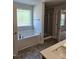 Bathroom with a tub, shower, and double sinks at 29 High Hampton Way, Fuquay Varina, NC 27526
