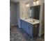 Bathroom with double sinks and granite countertops at 29 High Hampton Way, Fuquay Varina, NC 27526
