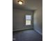 Cozy bedroom with carpet floors and a window at 29 High Hampton Way, Fuquay Varina, NC 27526