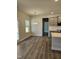Open dining area with wood floors, recessed lights, and views to the backyard at 29 High Hampton Way, Fuquay Varina, NC 27526