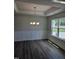 Formal dining room featuring hardwood floors, modern lighting, and large windows at 29 High Hampton Way, Fuquay Varina, NC 27526