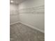 Walk-in closet with carpet floors and wire shelves at 29 High Hampton Way, Fuquay Varina, NC 27526