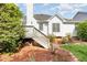Backyard features mature landscaping and a deck accessible by steps at 300 Ravenstone Dr, Cary, NC 27518