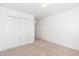 Bedroom with double door closet, neutral carpet, and door to the hall, ready for customization at 300 Ravenstone Dr, Cary, NC 27518