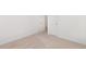 This bedroom features neutral carpeting and freshly painted white walls at 300 Ravenstone Dr, Cary, NC 27518