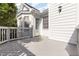 Deck made from painted wood and white siding makes for a private outdoor retreat at 300 Ravenstone Dr, Cary, NC 27518