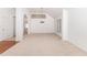 Spacious, naturally lit living room with neutral carpet ready for your personal design at 300 Ravenstone Dr, Cary, NC 27518