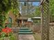 Beautiful backyard featuring a multi-level deck, mature trees, and wooden pergola at 3009 Pleasant Hill Church Rd, Siler City, NC 27344