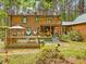 Log home with backyard deck, gazebo, and green trim at 3009 Pleasant Hill Church Rd, Siler City, NC 27344