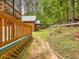 Scenic backyard with a path and views of a shed in a wooded area at 3009 Pleasant Hill Church Rd, Siler City, NC 27344