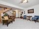 Finished basement featuring a staircase, neutral carpet, seating area, and bright white walls at 3009 Pleasant Hill Church Rd, Siler City, NC 27344