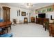 Finished basement area with neutral carpet, entertainment center, and natural light from a window at 3009 Pleasant Hill Church Rd, Siler City, NC 27344