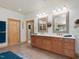 Bright bathroom featuring double vanity, quartz countertops, and decorative mirrors at 3009 Pleasant Hill Church Rd, Siler City, NC 27344