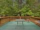 Inviting outdoor deck surrounded by lush greenery, perfect for relaxing and entertaining guests at 3009 Pleasant Hill Church Rd, Siler City, NC 27344