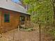 View of the wood home with metal roof and natural surroundings at 3009 Pleasant Hill Church Rd, Siler City, NC 27344